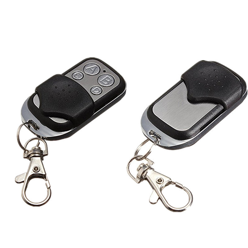 Two identical 4-button remote key fobs with sliding covers, metal front panels, and keychain clips—ideal for garage doors, gates, or electronic systems.